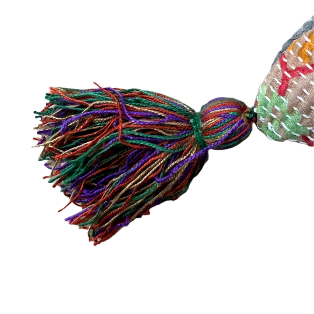 
                      
                        Peach Kantha Cushion Cover with Multi Colour Tassels
                      
                    